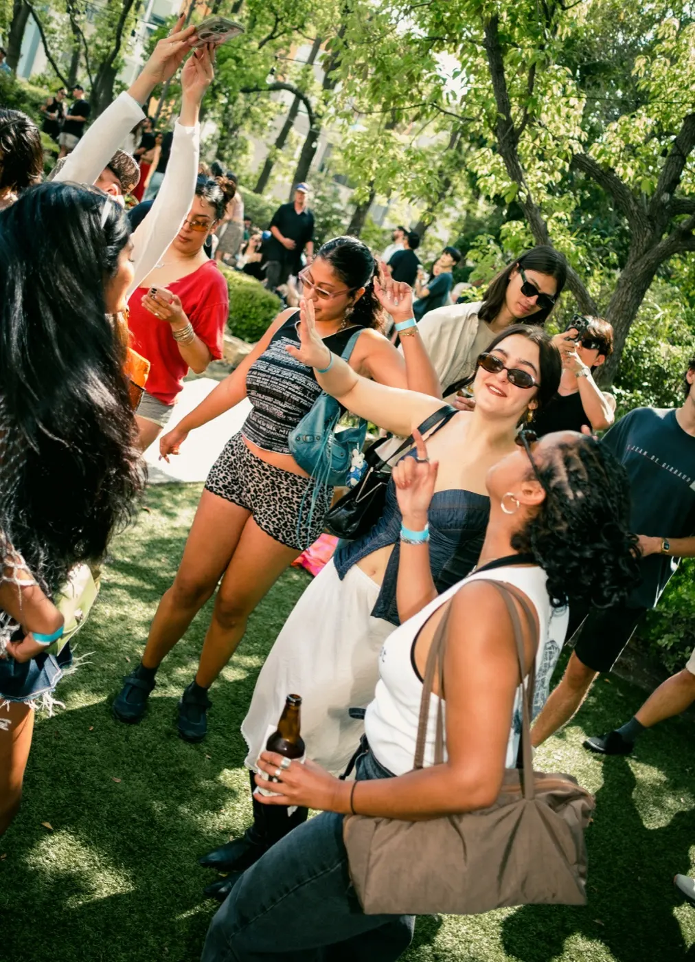 Guests dancing with hands raised in the crowd