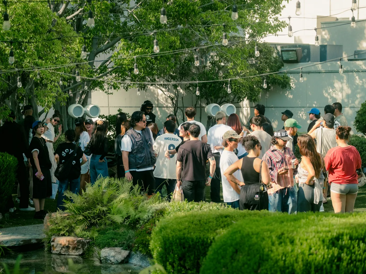 Guests filling the walkways of the Japanese garden