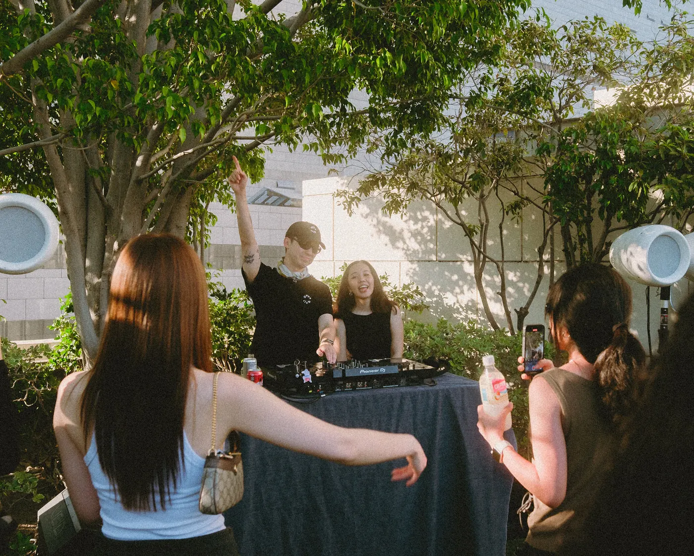 Guests dancing in front of the DJ table