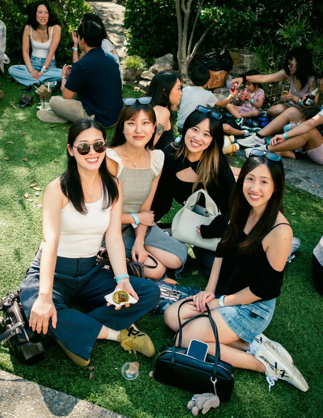 Friends sitting together on the lawn